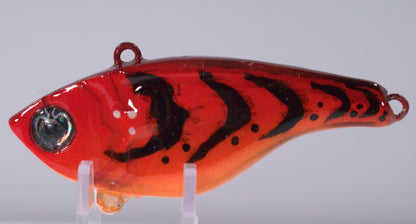 ½ oz Fire Craw Lipless Crankbait

Turn up the heat with the Fire Red Craw Lipless Crankbait — a ½ oz lure built to get crushed when the bite gets tough. Its bold electric red craw pattern mimics a fleeing crawfish , a proven trigger for reaction strikes from hungry bass.

Designed for maximum vibration and sound, this lipless crankbait features a tight, hard-thumping action and loud internal rattles that draw fish from a distance. The streamlined body design allows for long casts.