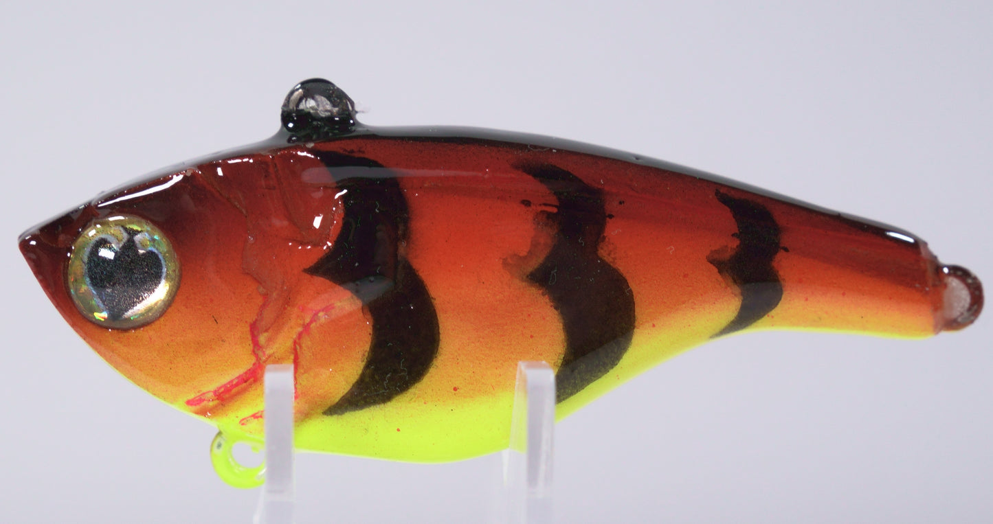 ½ oz Rootbeer Sparkle Lipless Crankbait

The Rootbeer Sparkle Lipless Crankbait is a ½ oz fish-catching machine built for flash, vibration, and versatility. Its rich rootbeer hue and subtle sparkle finish perfectly imitate crawfish and baitfish in clear or lightly stained water — a color proven to trigger bites when conditions get tough.

Designed for a tight, hard-thumping action and armed with rattles, this lure calls in aggressive strikes from bass, walleye, and pike.