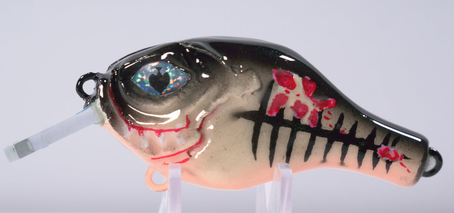 The Sinister Squarebill in Rootbeer Sparkle is a 0.7 oz shallow-diving crankbait designed to bring the heat when bass are feeding on crawfish. Diving 3 to 5 feet, this lure excels around rock, wood, and shallow structure where big fish hunt. The Fire Craw color pattern combines deep reds, burnt orange, and black accents to perfectly imitate a defensive crawfish — irresistible to pre-spawn and early spring bass.

Built with a squarebill design for a bold, erratic deflection, that crashes through cover