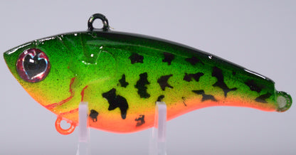 ½ oz Toxic Tiger Lipless Crankbait
Ignite aggressive strikes with our Fire Tiger Lipless Crankbait — a ½ oz powerhouse designed for covering water and triggering reaction bites. The vibrant Fire Tiger pattern flashes bold greens, oranges, and yellows that stand out in stained or murky water, making it irresistible to bass, walleye, and pike alike.

This lure features a tight, vibrating wobble that mimics fleeing baitfish, while internal rattles call in fish from a distance. Perfect for yo-yo retrieves 